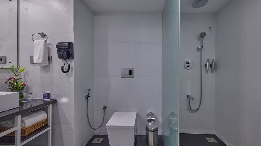 a water closet and shower area in the washroom at The Grand Premier King Sea View at Grand Continent, Mahabalipuram